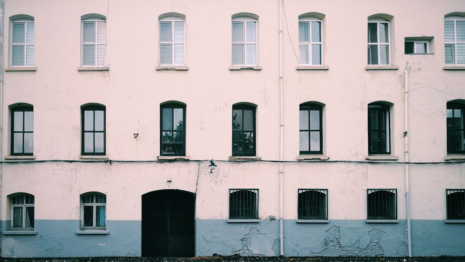 Painted house exterior with windows