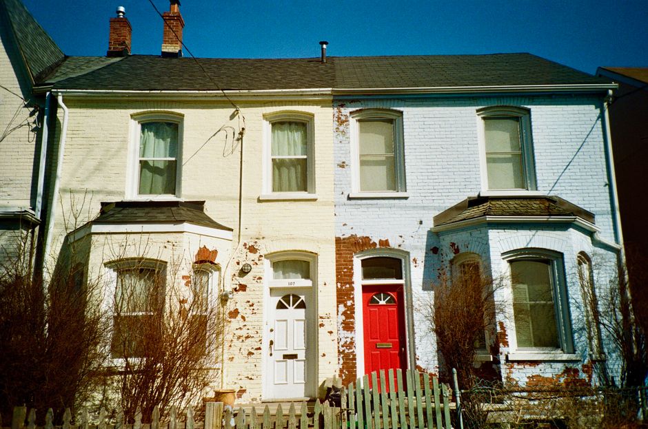 Painted house front with red and white doors